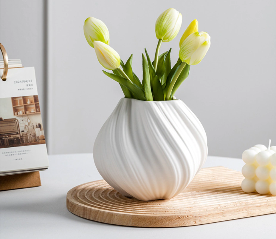 Studio photograph of the Lunara Flow Orb Vase — actual Dehua white porcelain