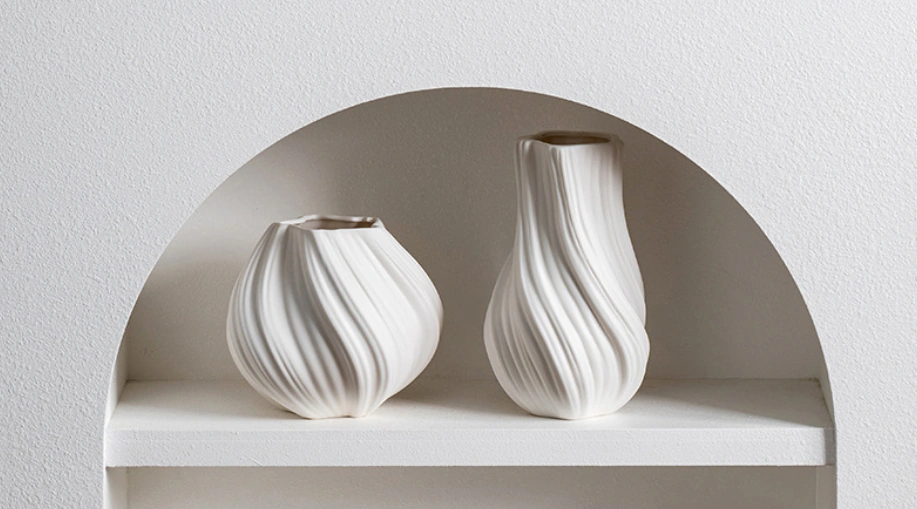 Studio photograph of Lunara Flow Orb Vase styled in a living scene
