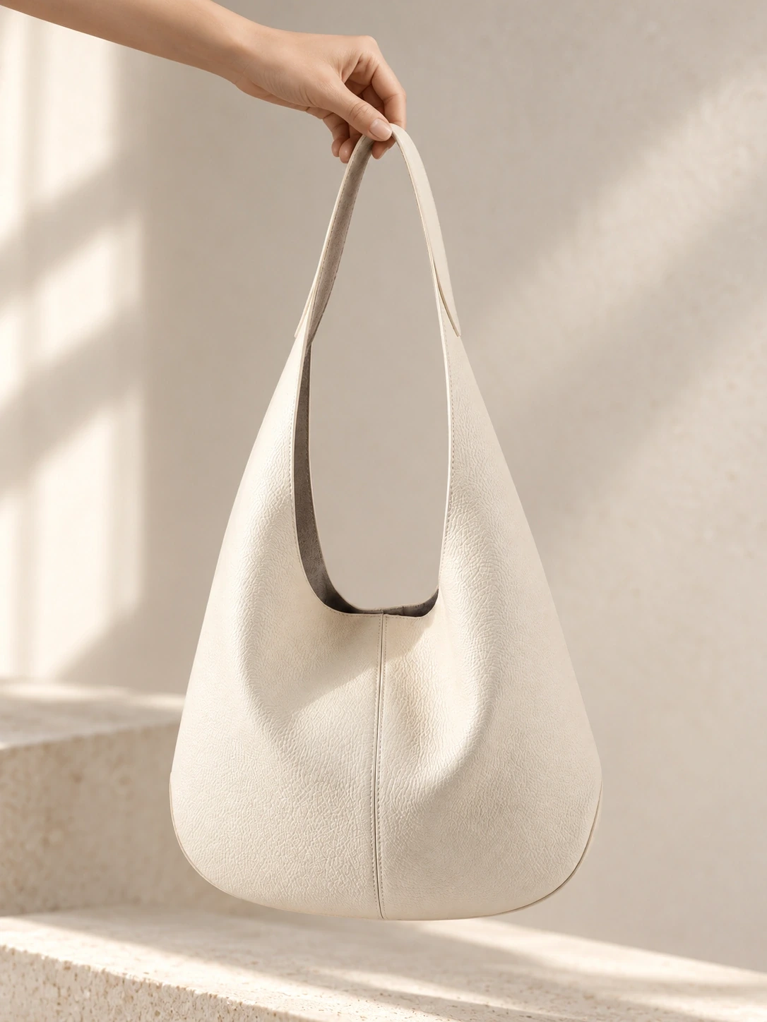 Held upright soft leather tote with open top